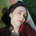 Contemporary fine art photography women, Steve Giovinco, in sunlight in colorful sweater