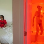Contemporary fine art photography couples self portraits, Steve Giovinco, getting out of red bathroom
