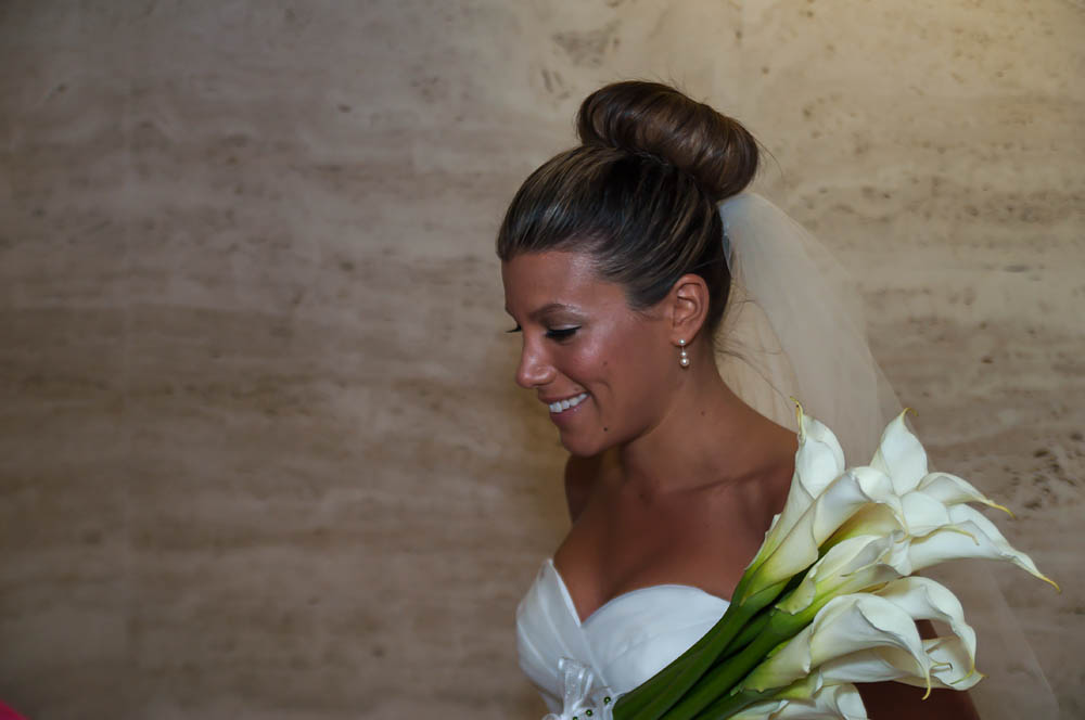 Fine art documentary wedding commission photography in NYC, carring flowers, Steve Giovinco