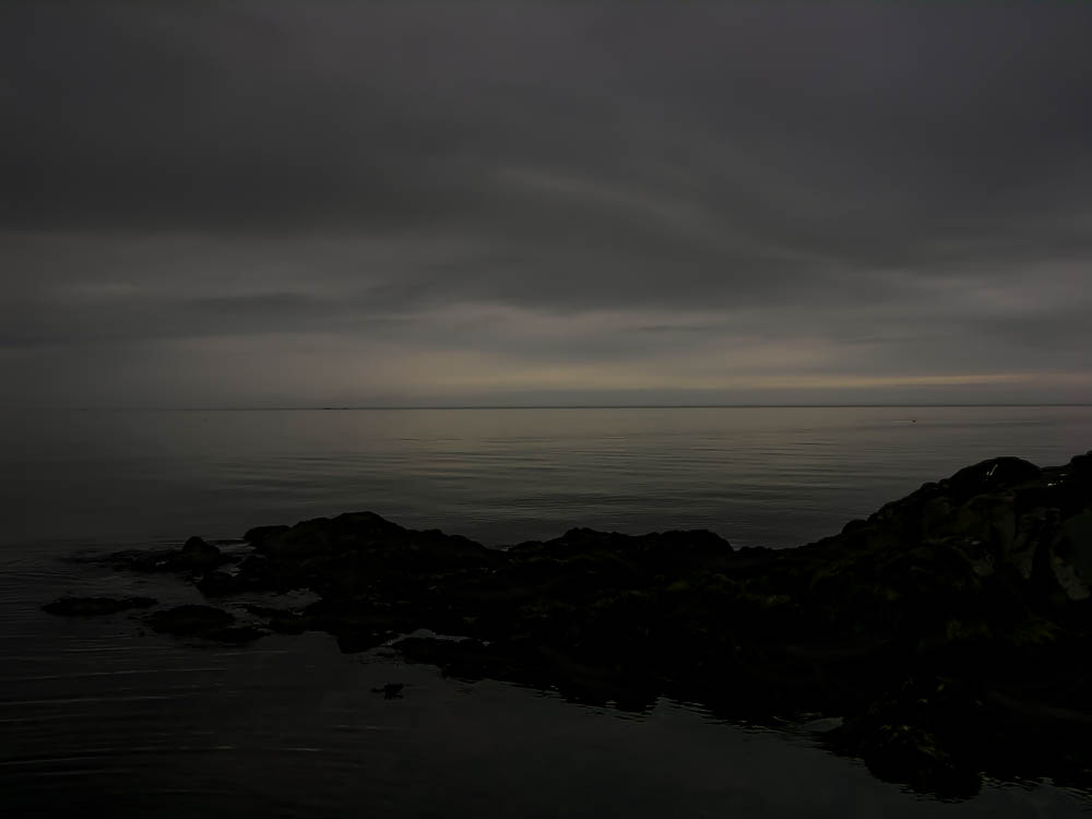 Fog at Twilight; Horizon Blending Sky and Water (Nightlandscape in Newfoundland)