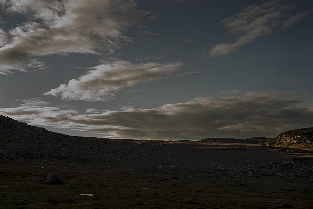 Darkland: Night Landscape Photographs in East Greenland Fence at Twilight