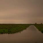 Sites at Risk of Climate Change: Night Landscape Photographs in The Netherlands, Steve Giovinco, Canal, on Yellow Rainy Night, Nieuw Land National Park, Flevoland