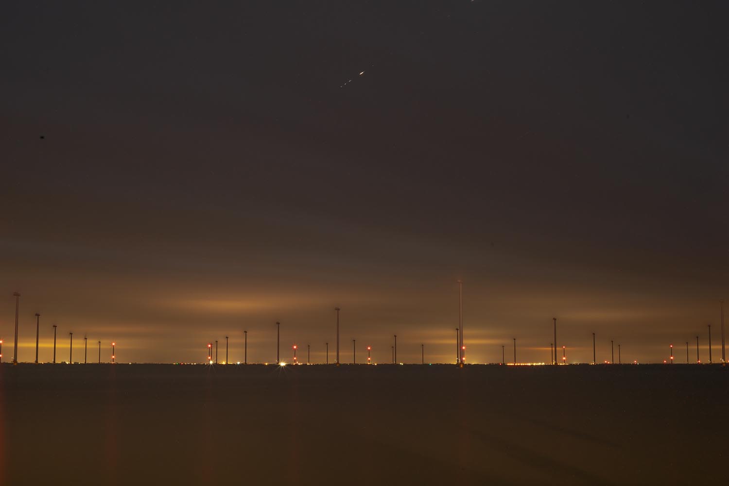 Sites at Risk of Climate Change: Night Landscape Photographs in The Netherlands, Steve Giovinco, Eerie Wind Farm Sustainable Energy with Strange Yellow Glowing Light Fryslan, Flevoland