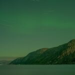 Shadow and Light: New Night Landscape Photographs of Greenland By Steve Giovinco. Green Lights Over Fjord at Night