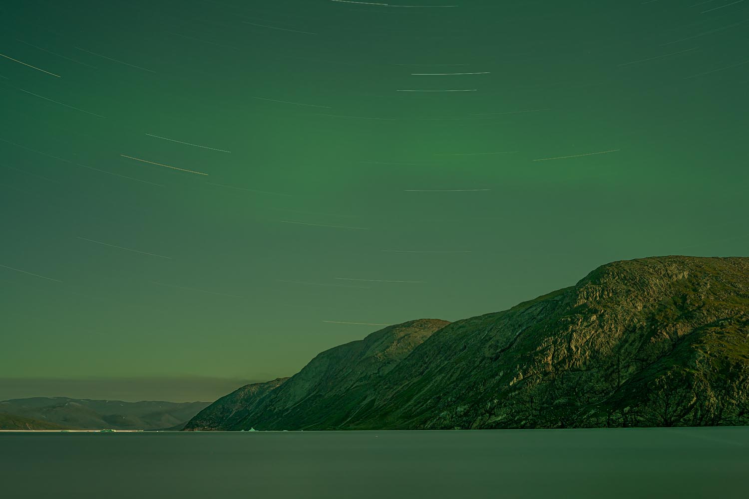 Shadow and Light: New Night Landscape Photographs of Greenland By Steve Giovinco. Green Lights Over Fjord at Night