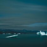 Shadow and Light: New Night Landscape Photographs of Greenland By Steve Giovinco. Icebergs, Moving in the Night in Fjord